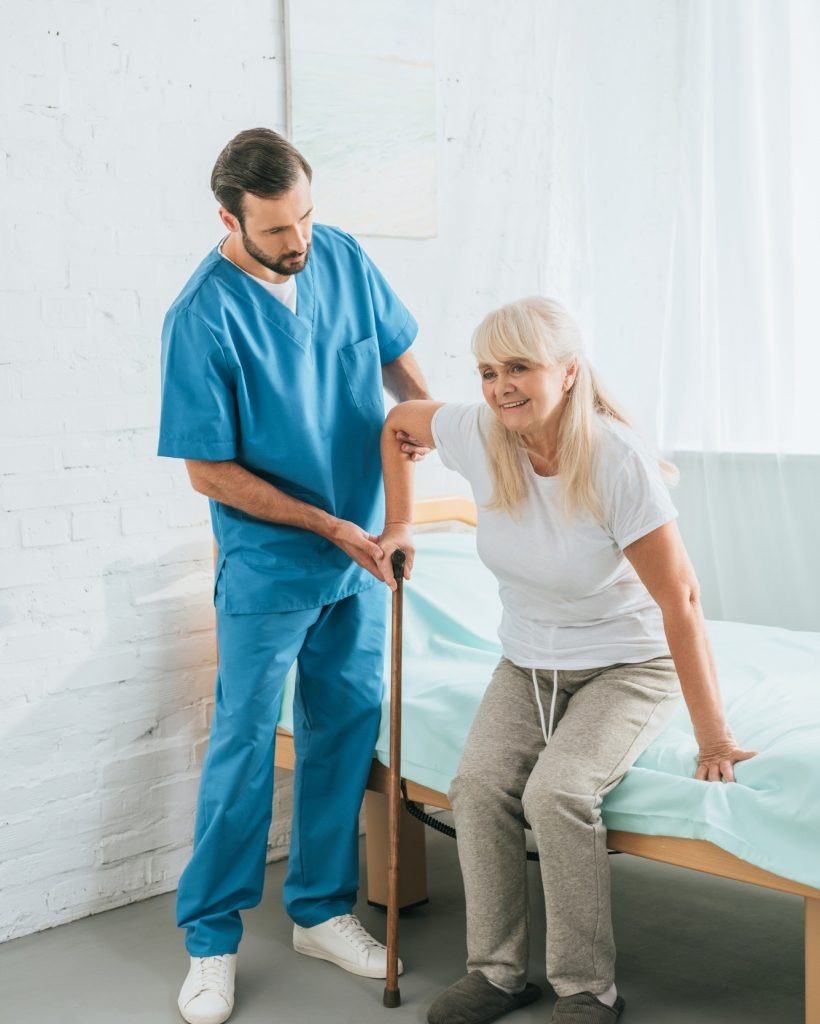 male-nurse-helping-senior-woman